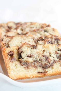 two slices of cinnamon swirl coffee cake on a white plate