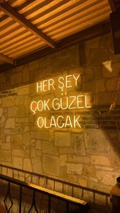 there is a neon sign on the wall that says her sey cook guze olacak