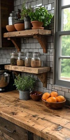 a wooden counter topped with shelves filled with oranges