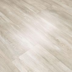 an image of a wood floor that looks like it has been painted in light grey