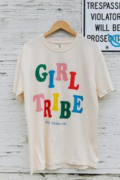 Buy Girl Tribe Rainbow Tee for only $38.00 at Girl Tribe Co.! Unisex Cute Graphic Print Tops, Trendy Cotton Tops With Custom Print, Fun Unisex Tops With Custom Print, Fun Unisex Custom Print Tops, Retro T-shirt With Letter Print, Retro Cotton Top With Custom Print, Vintage Cotton Tops With Custom Print, Vintage Cotton Top With Custom Print, Girl Tribe