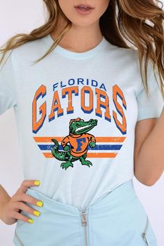 FLORIDA GATORS,FOOTBALL UNISEX SHORT SLEEVE,GRAPHIC TEE,GRAPHIC TSHIRTS,TSHIRTS,TEES100%COTTON,HEATHER(52%COTTON,48%POLY),ATH.HEATHER,BLACK HEATHER(90%COTTON,573%POLY)NICARAGUAMade In: Nicaragua Florida Gators Football, Gators Football, Essential Oil Accessories, Plus Swimwear, Florida Gators, Skirted Swimwear, Unisex Shorts, Heather Black, Nicaragua