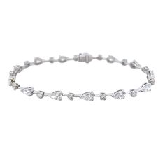 This timeless, luxurious 18k white gold tennis bracelet features a dazzling array of both oval and round diamonds for a total weight of 4.97 carats. Its classic design is sure to captivate and add an elegant touch to any ensemble. DIAMOND 3.96 RD TCW 13 PCS. F-G VS1-VS2& 1.01 RD TCW 13 PCS. D-F VS1-VS2 BS-1706 Luxury Pear-shaped Formal Bracelets, Luxury Pear-shaped Bracelets For Formal Occasions, Pear-shaped Luxury Bracelets For Formal Occasions, Elegant Pear-shaped Cubic Zirconia Diamond Bracelet, Elegant Pear-shaped Diamond Bracelet For Anniversary, Elegant White Gold Pear-shaped Bracelets, Pear-shaped Brilliant Cut Diamond Bracelet For Formal Occasions, Formal Pear-shaped Brilliant Cut Diamond Bracelet, Luxury Pear-shaped Cubic Zirconia Diamond Bracelet