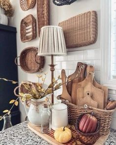 a kitchen counter topped with lots of food and cooking utensils on top of a wooden tray