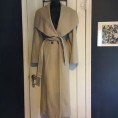 Mondi Virgin Wool And Silk Blend Coat Waterfall Coat. Size 34. I Am Posting Measurements Because Coat Is Oversized. Laying Flat Bust Measures 21 Inches Across Pit To Pit And 51 Inches Long From Top Shoulder To Bottom Hem. Fully Lined. The Lapel Is What Has Wear As Pictured. Formal Neutral Outerwear For Winter, Formal Neutral Winter Outerwear, Elegant Long Neutral Outerwear, Cream Long Outerwear For Work, Long Cream Outerwear For Work, Fitted Beige Outerwear With Shawl Collar, Beige Fitted Shawl Collar Outerwear, Elegant Luxury Single-breasted Wool Coat, Luxury Long Wool Coat With Double-breasted Button