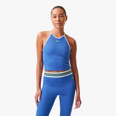 A fresh take on the classic workout tank, this high-neck halter offers a chic note to a performance staple. High Stretch Racerback Halter Top For Sports, Sporty Stretch Halter Neck Sports Bra, Sporty Halter Neck Stretch Sports Bra, Sporty Fitted Halter Neck Sports Bra, Fitted Halter Neck Sports Bra, Summer Sports Halter Neck Activewear, Sporty Stretch Halter Top For Sports, Sporty Fitted Halter Top For Gym, Summer Halter Neck Activewear