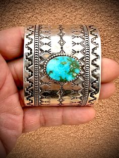 A beautiful wide sterling silver cuff with an oval turquoise stone. A definite must have that will get noticed by everyone at any event. 2 1/2" long and 2" wide Wide Open Spaces, Kids Earrings, Turquoise Cuff, Open Spaces, Sterling Silver Cuff, Barbie Girl, Silver Cuff, Open Space, Turquoise Stone