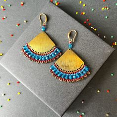 These earrings epitomize craftsmanship, utilizing top-tier branded beads such as Miyuki Delica beads and TOHO seed beads. Meticulously handcrafted with a robust beading thread, these earrings guarantee enduring shape retention and bead stability, even with continuous wear. A diverse spectrum of color combinations is available to cater to individual preferences, while all metallic components are expertly fashioned from high-quality brass. Hypoallergenic earring hooks prioritize wearer comfort and safety. Each design in the shop reflects a profound commitment to artistry, characterized by painstaking attention to detail.  Importantly, please consider potential slight variations in product color due to lighting and monitor calibration. Recommended care guidelines include precautions against w Brass Earrings With Gold Beads For Festivals, Festival Brass Earrings With Gold Beads, Brass Beaded Earrings As Gift, Brass Beaded Earrings For Gifts, Handmade Metal Beaded Earrings For Festive Occasions, Festive Handmade Metal Beaded Earrings, Brass Beaded Earrings With Tiny Beads As Gift, Multicolor Beaded Brass Earrings For Gift, Multicolor Brass Beaded Earrings For Gift