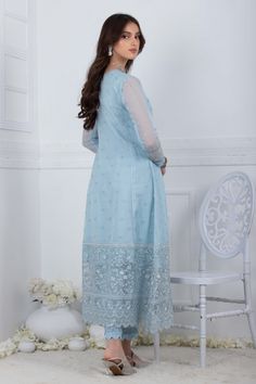 Using a contrast of refreshing powder blue, this net angrakha is made with delicate lace work high low double tassels made of crystal beads, pearls and contrasting thread. Continued with fully Embroidered border offset with lace detailed straight pants and delicately thread work on dupatta which has rich thread work tassels on four sides to make them look more effortless. Shirt Fabric: Embroidered khadi Net Shirt Length: 48” (customizable, mention in order notes) pants Fabric: Raw silk Dupatta F Work On Dupatta, Net Shirt, Luxury Pret, Wedding Types, Wedding Mehndi, Lv Shoes, Pants Fabric, Embroidered Border, Designer Outfits