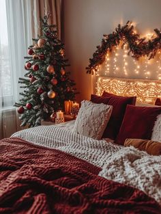 a bedroom decorated for christmas with lights on the headboard and tree in the corner