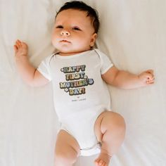 Celebrate her first Mother's Day with a sprinkle of nostalgia. Our retro baby bodysuit is adorned with the heartfelt proclamation 'Happy First Mother's Day' in a vibrant 60s/70s font. This unique gift showcases bright white daisy flowers, making your baby look even cuter if thats even possible. Also, you can add who it's from to make this gift extra 
special! 70s Font, Retro Baby, First Mothers Day, Mom And Grandma, Daisy Flowers, White Daisy, Personalized Pillows, Mom Gifts, Daisy Flower