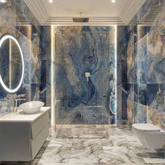 a bathroom with blue marble walls and flooring