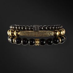 Chase your luck with the Vegas bracelet stack! The Vegas stack features trifecta of beaded beauties - black onyx, golden glitz, and rhodium PVD for a triple threat of style. Plus, a lucky dice and CZ bar for a dash of extra luck. Indulging the adventurous spirit and wandering heart that lives within all of us, our men's bracelet stacks have been crafted to provide a touch of class to your wardrobe throughout the year. Each exquistely curated stack includes a mix of spiritually healing gemstones Luxury Beaded Onyx Jewelry, Elegant Stacked Bracelets With Round Beads, Adjustable Stacked Black Beaded Bracelets, Luxury Onyx Beaded Jewelry, Luxury Black Adjustable Beaded Bracelet, Luxury Black Jewelry With 8mm Beads, Luxury Adjustable Bracelets With Black Beads, Adjustable Gold Onyx Bracelet, Adjustable Gold Onyx Bracelets