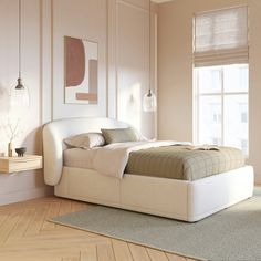 a white bed sitting on top of a hard wood floor next to a large window