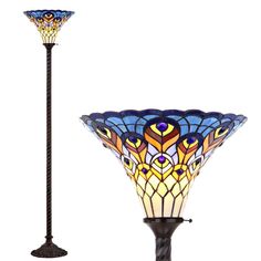 a stained glass floor lamp next to a tall light pole with an intricate design on it