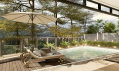 an outdoor swimming pool with chaise lounge chairs and umbrellas on the decking area