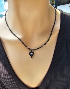 This is a blackened steel Gothic black heart Pagan witchy Necklace that looks great alone or layered with others. The minimalist design gives it a trendy and stylish feel, while the black steel gives it a touch of gothic Punk edge. This necklace comes in two sizes: Small runs approximately from 14 to 16 inches with a built-in extender.  Large runs approximately 16 to 18 inches with a built-in extender.  This is a dainty chain, but is strong steel.. PLEASE NOTE FOR RETURNS! If I accept returns on Punk Style Heart Necklace For Gift, Black Punk Heart Pendant Jewelry, Punk Style Metal Heart Necklace Gift, Punk Style Metal Heart Necklace For Gift, Gothic Black Necklace For Valentine's Day, Black Gothic Necklace For Valentine's Day, Punk Style Black Necklace For Valentine's Day, Grunge Style Heart-shaped Metal Jewelry, Emo Heart-shaped Jewelry Gift