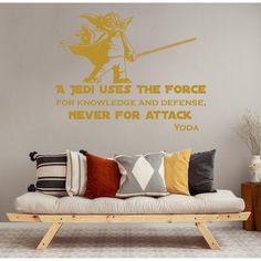 a star wars wall decal with the quote, a jedi uses the force for knowledge and defense never for attack yoda