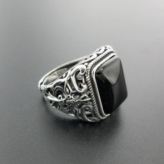 This square-shaped hollow carved punk ring made from real 925 sterling silver with natural black onyx stone. Specification: Brand Name: GQTorchStyle: Vintage, Fashion, Punk, RockGender: MenSize: Re-sizableItem Type: RingsRings Type: Cocktail RingColor: SilverStone: OnyxMaterial: MetalMetals Type: 925 Sterling SilverSetting Type: Tension MountSurface Width: 15mmOccasion: Party Punk Jewelry, Black Onyx Stone, Black Onyx Ring, Mens Silver Rings, Ring For Men, Viking Jewelry, Onyx Ring, Onyx Stone, Garnet Rings