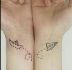 two people with matching tattoos on their arms