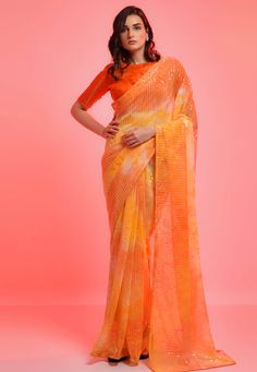 Chiffon Saree with blouse in Orange colour 6021  Desc:  Style : Light Weight Sarees Color : Orange Fabric : Chiffon Work : Sequence Wash Care : Dry clean Sleeve Style : Half Sleeve Long Sleeves : Done only in Custom Stitch Sleeves Lining : Done only in Custom Stitch Bust Size : 32 to 42 Inches Occasion : Engagement   Wedding   Festival   Kitty Party   Mehendi   Sangeet   Reception   Ceremonial   Party Wear. With Express Free Shipping and Custom Stitching, Buy Indian Party wedding and bridal Sare Orange Colour Saree, Sequence Saree, Sequin Saree, Orange Saree, Orange Chiffon, Designer Sarees Collection, Yellow Saree, Indian Sarees Online, Wedding Saree Indian