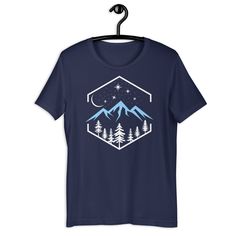 Introducing our Nature at Night T-Shirt - a wearable masterpiece that captures the serene beauty of the great outdoors in a sleek and modern design. This t-shirt is not just clothing; it's a window to tranquility, a canvas of calmness that you can carry with you wherever you go. The Nature at Night t-shirt features a striking composition of pine trees, majestic mountains, and a star-studded night sky reminiscent of the beautiful Pacific Northwest. The design embodies the essence of nature's gran Short Sleeve Letter Print Sleep T-shirt, White Graphic Print Sleep T-shirt, Short Sleeve Graphic Print Sleep T-shirt, Short Sleeve Sleep T-shirt With Graphic Print, Blue Graphic Print Sleep Top, White Short Sleeve Sleep T-shirt, Nature At Night, Mountain Tshirt, Majestic Mountains