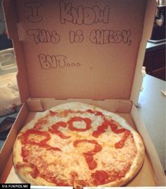 a pizza in a box with writing on it