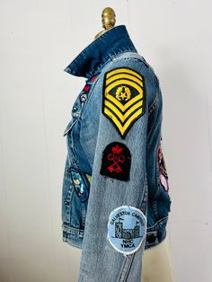 Retro Denim Jacket With Patches For Fall, Retro Cotton Denim Jacket With Patches, Retro Denim Jacket With Patches, Retro Blue Denim Jacket With Patches, Vintage Denim Outerwear With Embroidered Patch, Retro Denim Jacket With Patches For Streetwear, Vintage Blue Denim Jacket With Patches, Casual Denim Jacket With Patches In Recycled Denim, Denim Blue Recycled Denim Jacket With Patches