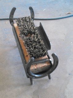 a brush is sitting on top of a bench