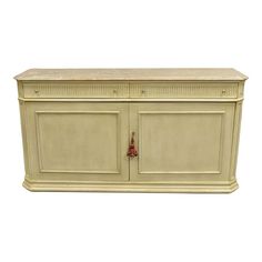 a white cabinet with two doors and drawers