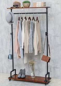 a rack with clothes and shoes hanging on it