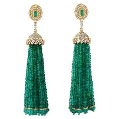 These stunning exceptional tassel earrings is handmade in 18-karat gold. It is set with 121.17 carats emerald, 2.03 baguette sapphire and 3.45 carats of glittering diamonds. FOLLOW MEGHNA JEWELS storefront to view the latest collection & exclusive pieces. Meghna Jewels is proudly rated as a Top Seller on 1stDibs with 5 star customer reviews. All items manufactured by us are handmade and can be customized or redesigned. Composition Size-82X14 MM Total Weight-40.12 Gold Weight(Gms)-14.74 Diamond Wt(Cts)-3.45 Emerald Wt(Cts)-121.17 Sapphire Wt(Cts)-2.03 Elegant Green Chandelier Earrings With Latkans, Luxury Evening Jewelry With Tassels, Elegant Tassel Earrings For Festive Occasions, Luxury Dangle Earrings With Latkans, Luxury Chandelier Earrings For Festive Occasions, Luxury Festive Chandelier Earrings, Formal Dangle Tassel Earrings With Latkans, Luxury Dangle Tassel Jewelry, Luxury Latkans Earrings For Formal Occasions