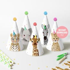 several party hats with animals and zebras on them