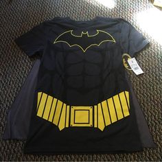 Nwt Batman Shirt With Velcro Cape. Perfect For Halloween! Comes From A Smoke Free And A Pet Free Home. Casual Yellow Top For Halloween, Black Tops For Comic-con Fan Conventions, Black Tops For Comic-con, Themed Black Shirt With Character Print, Themed Crew Neck Top For Cosplay, Black Crew Neck Top For Cosplay, Themed Black Top With Character Print, Themed Black Tops With Character Print, Pop Culture Top For Halloween Cosplay