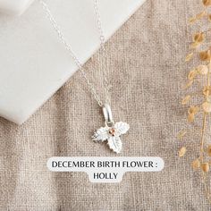 December Birth Flower Necklace : Sterling Silver Holly Necklace   Personalised Birthday Gift for Her - December Birthday Gift Idea Celebrate a December birthday with our exquisite sterling silver Holly Necklace. Each month of the year is associated with a special flower. December's flower is the holly. It symbolizes hope, protection, and everlasting life. The holly's leaves and berries capture the essence of the season and the people born in December.  ★ Product Details: * Material: sterling sil Birth Flower Jewelry For Birthdays, Silver Flower-shaped Necklace For Birthday, Silver Flower Shaped Necklace For Birthday, Flower Shaped Hallmark Jewelry For Birthday, Birthday Necklace With Flower Charm, Sterling Silver Flower Necklace For Birthday Gift, Sterling Silver Flower Necklace For Birthday, Flower Shaped Sterling Silver Necklace For Birthday Gift, Flower Shaped Sterling Silver Necklace For Birthday