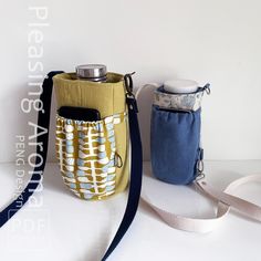 two small purses sitting next to each other on top of a white countertop