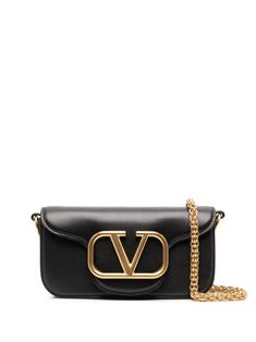 Locò leather crossbody bag from VALENTINO GARAVANI featuring black, leather, VLogo Signature, gold-tone hardware, partitioned compartment, foldover top with magnetic fastening, single detachable top handle and detachable chain-link shoulder strap. | Valentino Garavani Locò leather crossbody bag Leopard Tote, Valentino Garavani Bag, Ankle Tie Sandals, Bag Stand, Dolce E Gabbana, Shoulder Bag Black, Valentino Bags, Small Shoulder Bag, Bags Designer Fashion