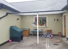 the back yard is clean and ready to be used as a children's playroom