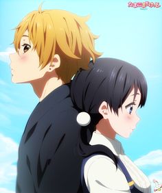 two anime characters standing next to each other