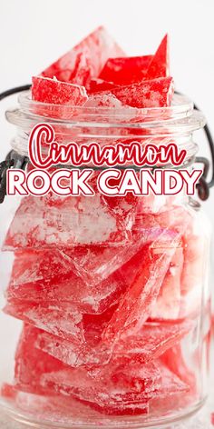 a glass jar filled with rock candy sitting on top of a table