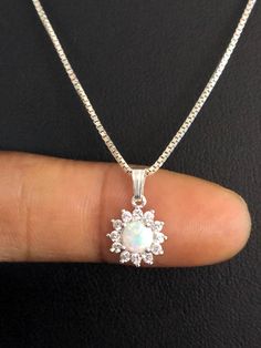 "Dainty & Tiny White Opal Necklace, Art Deco CZ Wedding Necklaces NECKLACE FEATURES: Metal: All components are made from solid .925 Sterling Silver Model is wearing 16\" in length solid .925 Sterling Silver Chain Length available: 16\", 18\" or 20\" Stone: Lab-Created White Opal & Cubic Zirconia Pendant Measurement: Height 15MM (0.6\"), including bail Width 9MM (0.4\") Your Tiny White Opal Necklace will arrive in a gift box, beautifully wrapped and ready for gifting Please send me a mess Beaded Ankle Bracelets, October Birthstone Jewelry, Fire Opal Necklace, Foot Jewelry, 925 Sterling Silver Chain, Opal Necklace, White Opal, October Birth Stone, Sterling Silver Bead