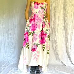 This Is A Sweet, Gorgeous Pink Floral Strapless High-Low Dress. Cute Pleats At The Waist All The Way Around That Gives It Movement And Shape. The Strapless Sweetheart Cut Has Built In Bra Cups And Has Boning At The Sides To Help Keep Fit. The Bottom Of The Gown Has A Light Plastic Trim Inside To Keep Flow And Shape. And. It Has Pockets! Never Worn Out, Only Tried On And Is So Cute. I Picture This At A Tea Party, Wedding, Derby. Pink Strapless Dress With Sweetheart Neckline For Garden Party, Pink Strapless Dress For Spring Garden Party, Pink Strapless Sweetheart Neckline Dress For Garden Party, Fitted Pink Floral Print Strapless Dress, Pink Strapless Dress For Garden Party, Pink Fitted Strapless Dress For Garden Party, Fitted Pink Strapless Dress For Garden Party, Tea Party Wedding, Plastic Trim