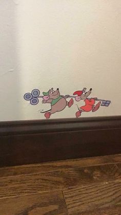 an image of two cartoon dogs playing with frisbees on the floor in front of a mirror