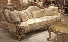 an ornately decorated couch and table in a store