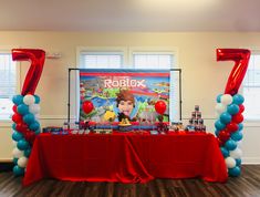 the table is set up with balloons and streamers to celebrate roblox's 7th birthday