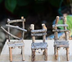 three small wooden chairs made out of logs