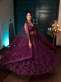 This jewelled purple lehenga features all over tonal sequin, crystal and cutdana embroidery. Paired with a strappy blouse with tassel string detailing and an embroidered dupatta in net.DELIVERY TIMEPlease allow 8-12 weeks for your outfit to arrive.FABRIC DETAILSNetProfessional cleaning only. Indian Reception Outfit, Lehenga Purple, Indian Wedding Reception Outfits, Strappy Blouse, Cutdana Embroidery, Purple Lehenga, Reception Outfits, Sangeet Outfit, Floral Lehenga