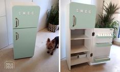 a small dog standing in front of an old refrigerator