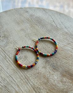 Beautiful beaded hoop earrings on a gold nickel free hoop Hoop Beaded Earrings With Spacer Beads, Everyday Colorful Beaded Hoop Earrings, Nickel-free Multicolor Hoop Earrings, Everyday Small Hoop Beaded Earrings With Colorful Beads, Everyday Colorful Bead Hoop Earrings, Everyday Colorful Beads Hoop Earrings, Everyday Small Hoop Earrings With Colorful Beads, Everyday Colorful Beaded Small Hoop Earrings, Everyday Multicolor Nickel-free Hoop Earrings