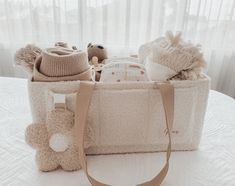 a white bag sitting on top of a table next to a stuffed animal and teddy bear